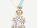 an image of a blue and white medal with a crown on it