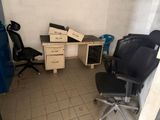 a room with a desk and a chair in it