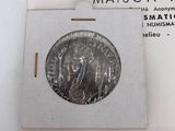 an image of a silver coin on a card