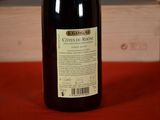 a bottle of wine that is sitting on a table