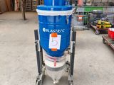 a blue machine that is sitting in a garage