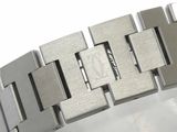 a close up of a watch bracelet on a white surface