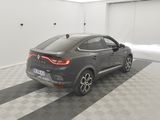 the rear end of a grey bmw suv parked in a garage