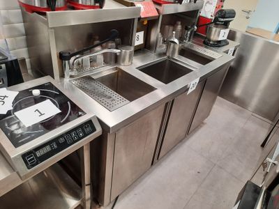 a kitchen with stainless steel appliances and a microwave
