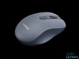 a computer mouse that is sitting on a black surface