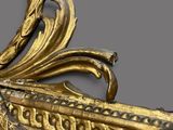 a gold plate with a decorative design on it