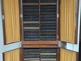 a large wooden cabinet with many drawers inside of it