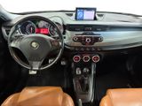 the interior of a car with a steering wheel, dashboard, and dashboard controls