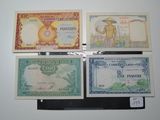 four different types of currency are displayed on a white surface