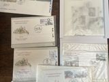 many envelopes that are sitting on a table