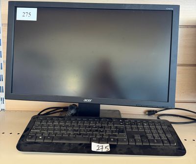a computer monitor with a keyboard and mouse on a desk