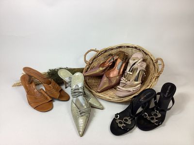 several pairs of women ' s shoes and a basket of shoes