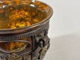 an image of a close up of a vase on a white surface