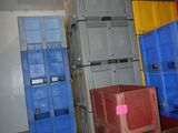 many crates stacked up in a room next to each other