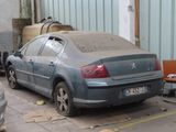 a car that is parked in a garage with graffiti on it