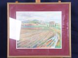 painting on easel of a landscape with trees and fields