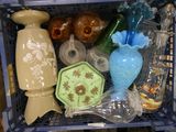 a basket full of vases and other items in it