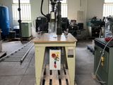 a machine that is sitting on a pallet in a building
