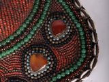 necklace made of beads and glass beads with red, green, and blue beads