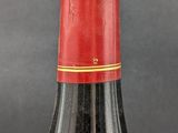 a bottle of wine that is sitting on a table