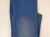 the back of a pair of blue jeans on a white background