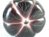 a black and red vase with a star design on it
