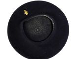 a black hat with a gold crown on top of it
