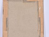 an old picture frame sitting on top of a white surface