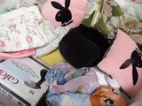 a pile of baby items that are sitting on a bed