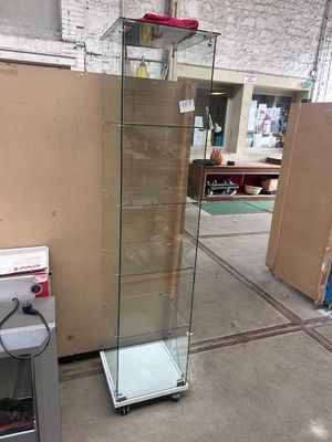 a glass display case with a red light on top of it