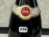 a bottle of wine that is sitting on a counter