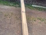 a wooden beam that is laying on the ground