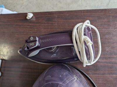 a close up of a pair of purple shoes on a table