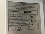 a label on the back of a white refrigerator
