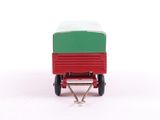 a small red wagon with a green top on a white surface