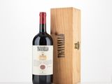 a bottle of wine sitting next to a wooden box
