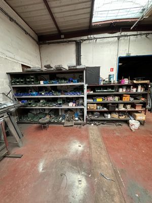 a room with a lot of shelves and a lot of tools