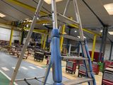 a ladder in the middle of a room that is being worked on