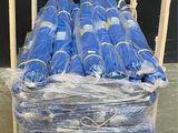 a pallet full of blue plastic bags on a pallet