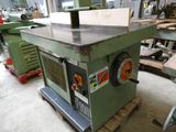 a machine that is sitting on a pallet in a workshop
