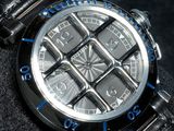 a close up of a watch on a black surface