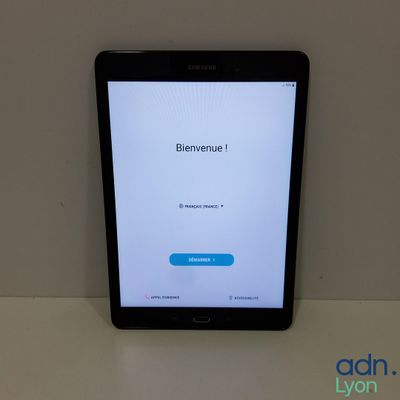 the tablet is sitting on top of the table with the app on it