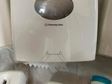three soap dispensers and two soap dispensers on the counter