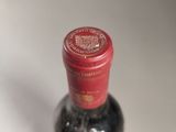 a bottle of wine that is sitting on a table
