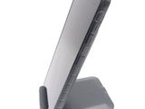 a cell phone that is sitting on top of a stand