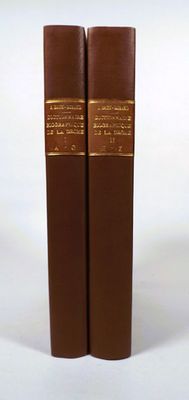 two books that are sitting on a white surface