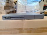 a video game console sitting on top of a cardboard box