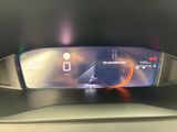 the dashboard of a car with a digital display on it