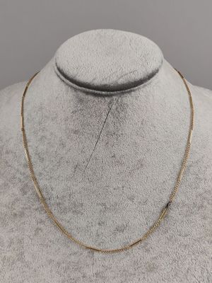 a gold necklace on a mannequin mannequin mannequin mannequin mannequin mannequin mannequin mannequin mannequin