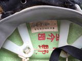 a close up of a helmet with a tag on it